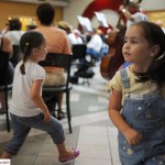 Twins dance along with "Turkey in the Straw" at the BSO Cowboy Concert